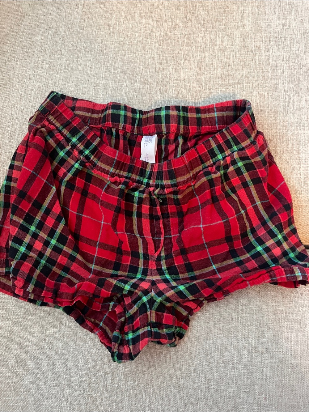 stars above Red and Black Plaid Lounge Shorts with Green Accents